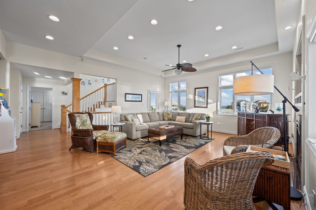 Bright and spacious living area with panoramic views&mdash;perfect for gathering and relaxing in natural coastal light