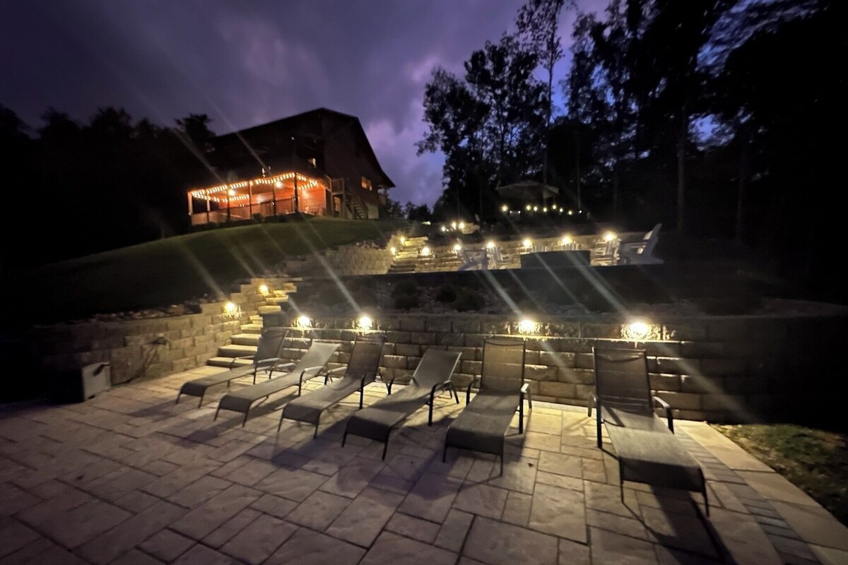 Patio lights are automatically turned on at night at dusk and on a timer located under the outdoor kitchen sink. 