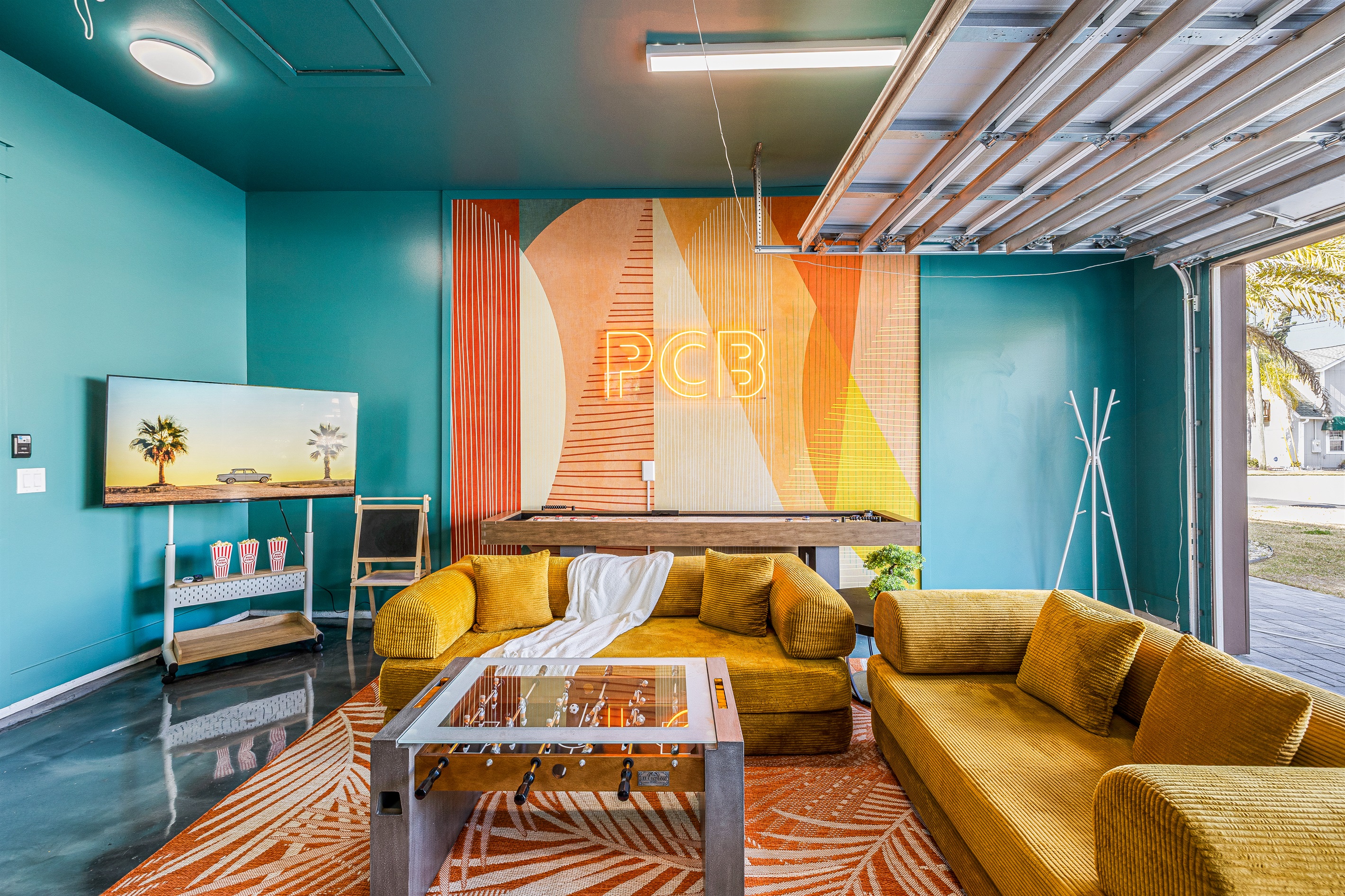 Ultimate Game Lounge – Relax between rounds on plush seating with foosball, shuffleboard, and our glowing PCB neon setting the vibe.