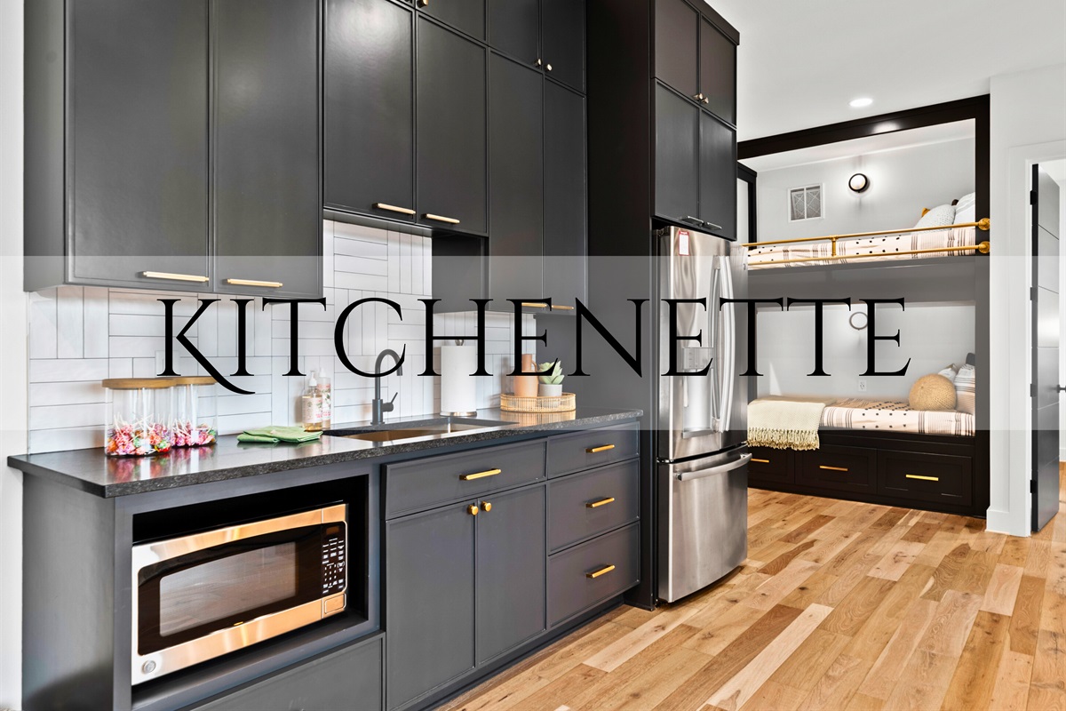 Enjoy the convenience of this beautifully designed kitchenette, with sleek cabinets and modern appliances.