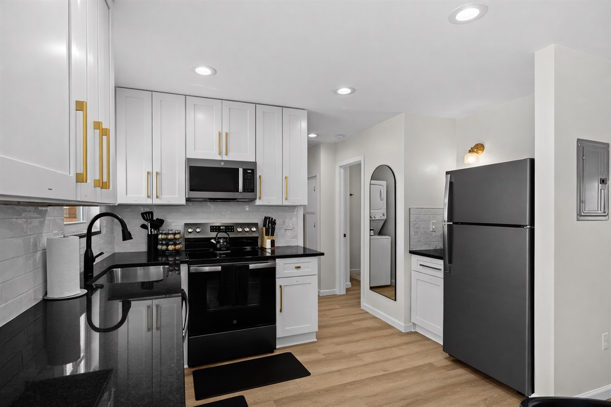 Sleek, modern kitchen with stainless appliances, ample cabinetry, and bright lighting—designed for effortless cooking and everyday comfort.