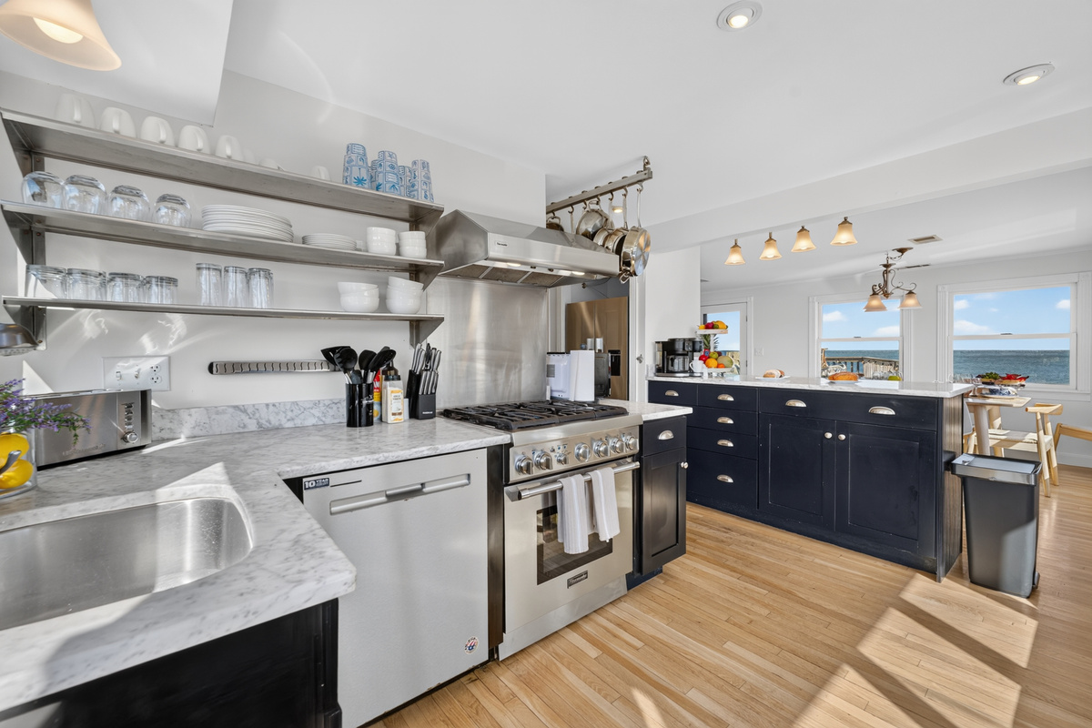 Spacious kitchen with ample workspace, storage, and appliances for convenient meals during your stay.