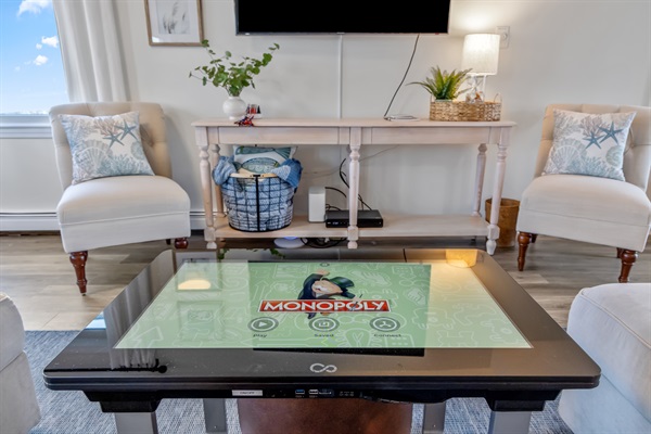 Gather around our modern digital table in the living room, where entertainment meets warmth for unforgettable moments together!