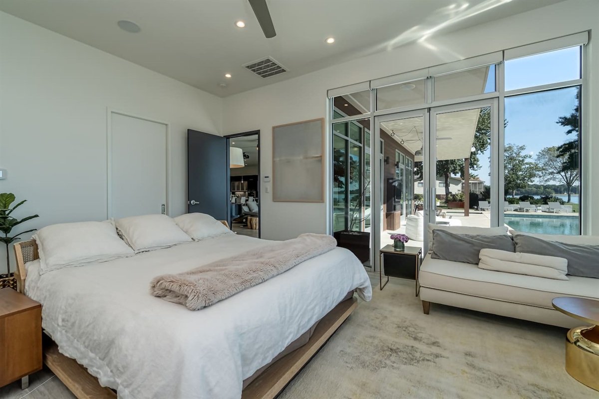 Master bedroom with attached guest bathroom overlooking pool