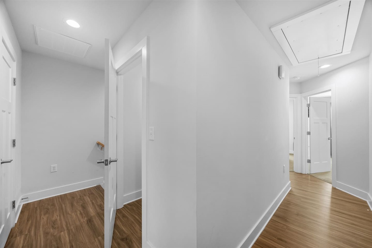 Spacious hallway connecting the bedrooms and bathroom, designed for comfort and privacy.