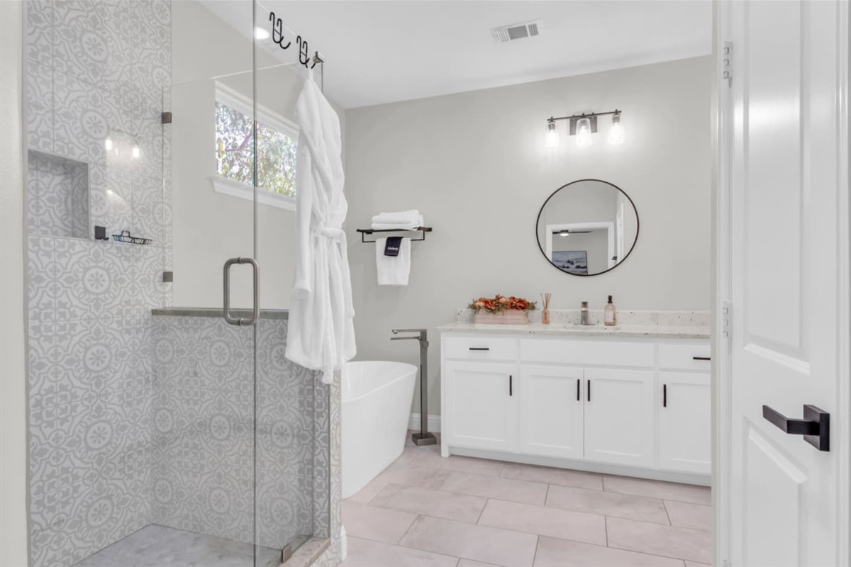 Spa-inspired bathroom with walk-in shower and dual vanity.
