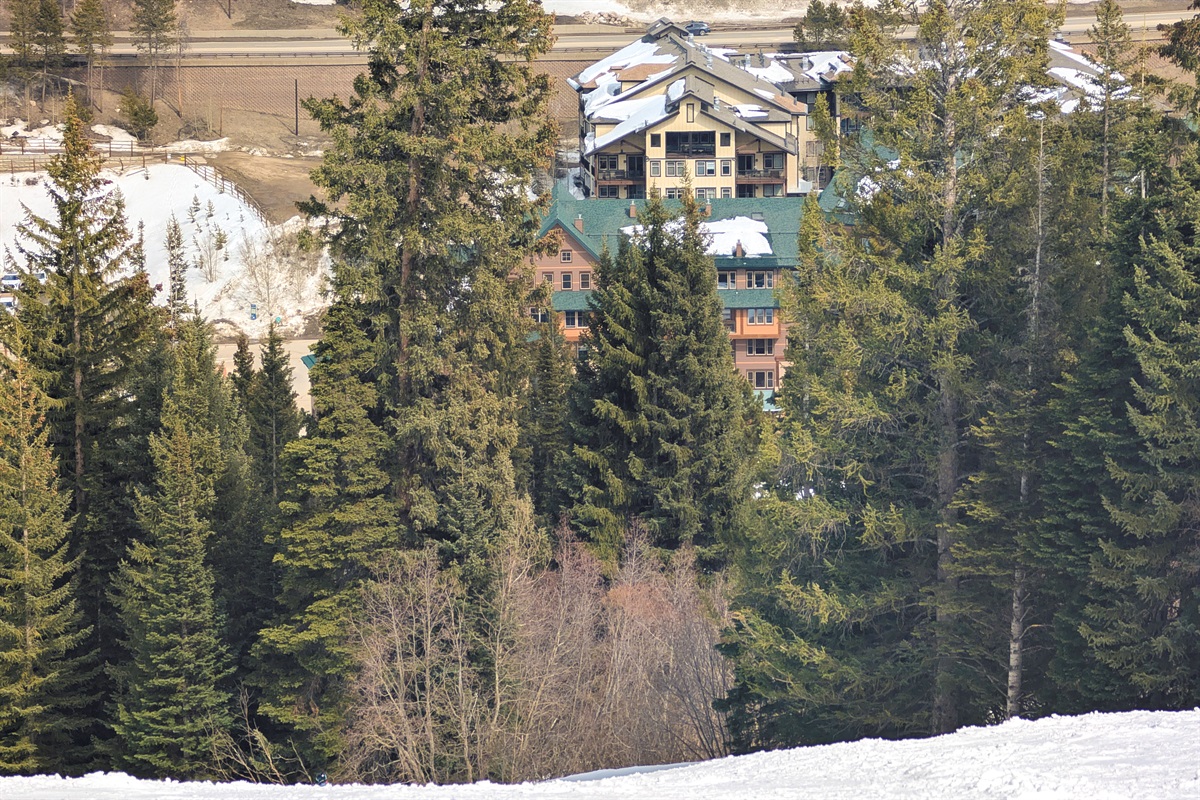 Condo as seen from slopes, is highest deck on right side of tan buildin