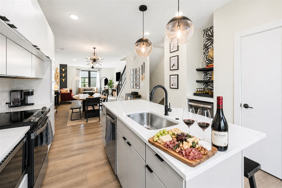 A beautifully designed kitchen featuring chef-grade appliances, quartz countertops, and elevated finishes&mdash;perfect for everything from morning coffee to evening wine and charcuterie.