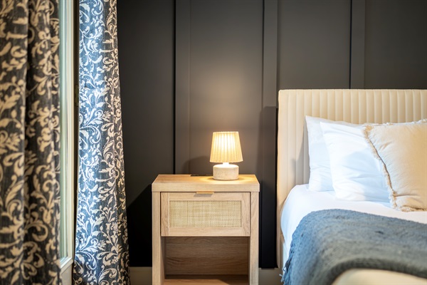 Nightstands with power outlets for easy device charging while you also recharge on a brand new memory foam mattress. 