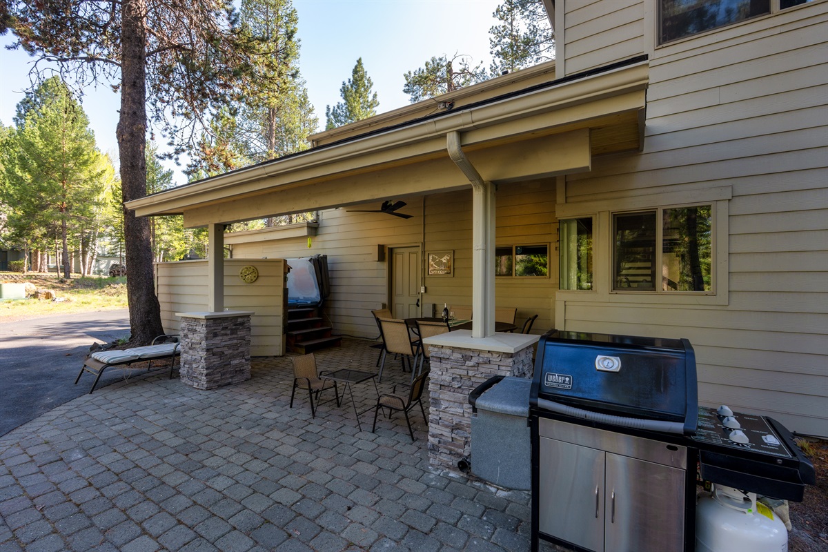 Enjoy a beautifully lit outdoor seating area designed for relaxed evenings, with an overhead fan to keep things cool and comfortable. Perfect setting to unwind, dine al fresco, or gather with family and friends, with a gas BBQ grill ready for meals.