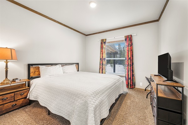 King bedroom 1 with TV for channel streaming