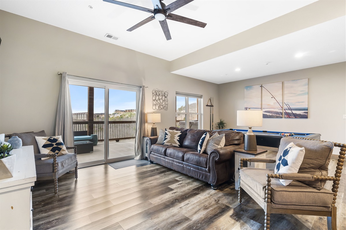 Spacious lower living room with walk-out back deck.