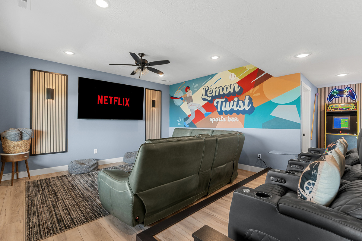 Movie nights on a large 85" TV with comfortable seating on power reclining sectional sofa and reclining theater seats
