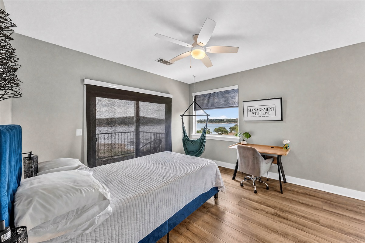 - Bright lakeview bedroom with workspace ideal for remote focused stays - Natural light enhances mornings and lifts your refreshing vacation mood - Cozy layout supports comfort, productivity, and calm throughout stay