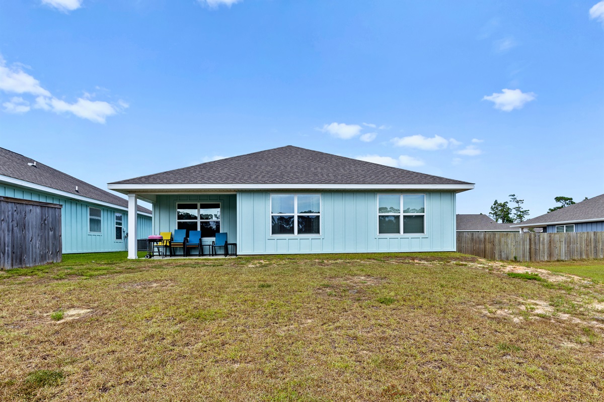 Spacious backyard for family fun, games, or simply soaking up the Gulf Coast sunshine.