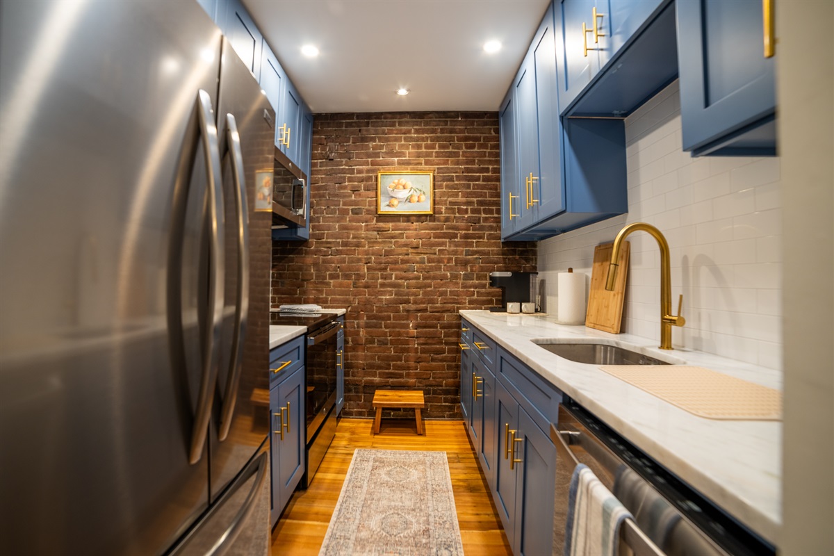 Fully equipped galley style kitchen. 