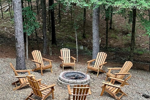 8 brand new Adirondack chairs encircle the fire pit