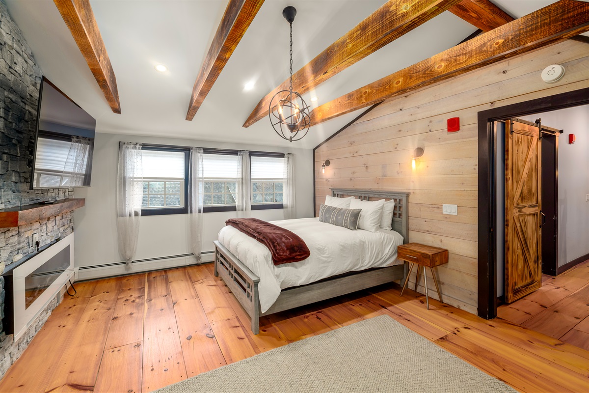 Primary bedroom with king bed and ensuite bathroom