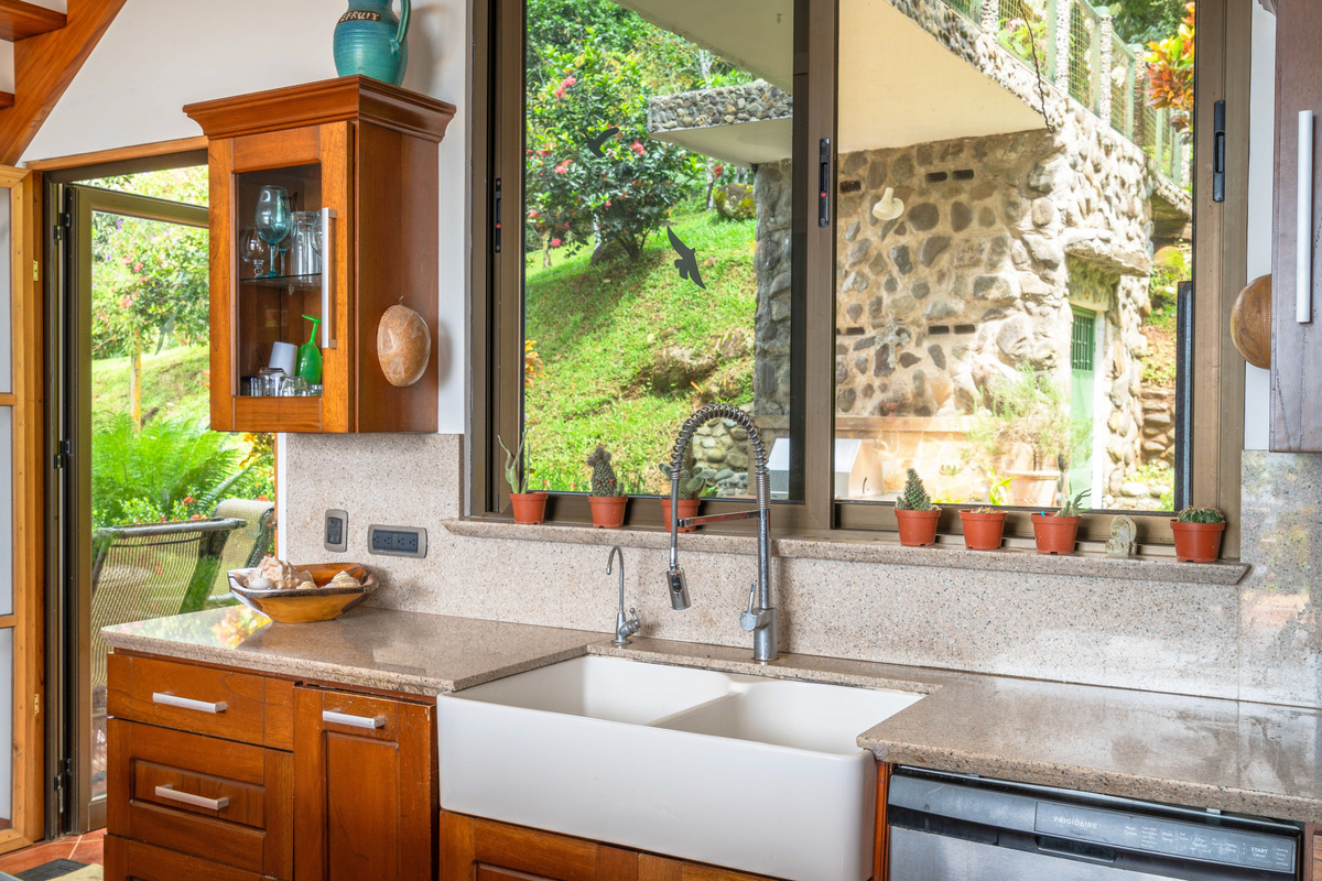 Kitchen window detail with garden views and natural light throughout