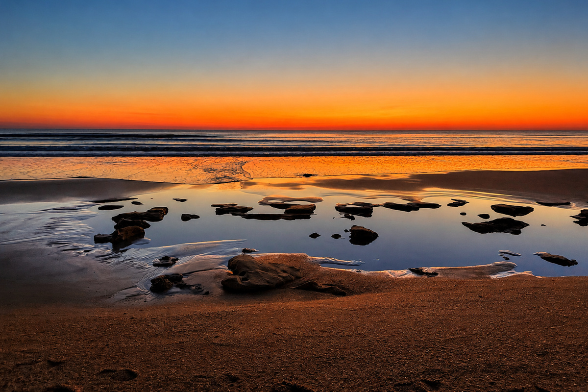Rise early just once and walk the empty shore as the sun lifts pink and gold over the Atlantic. Tide pools shimmer, sandpipers dart, and in that quiet hour the beach feels like it belongs to your family alone. Pure, unforgettable magic.
