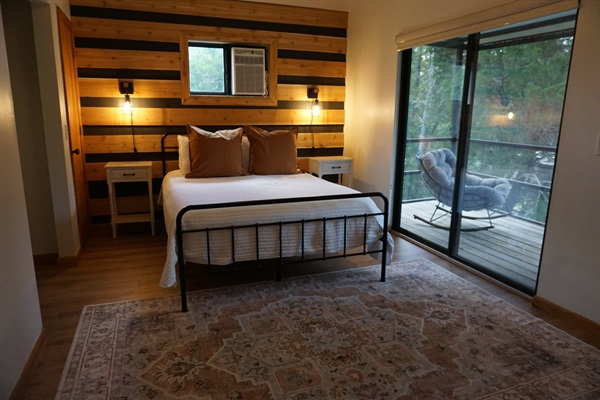 The upstairs bedroom is fitted with a queen size bed, Roku TV & private balcony overlooking the waterfront.