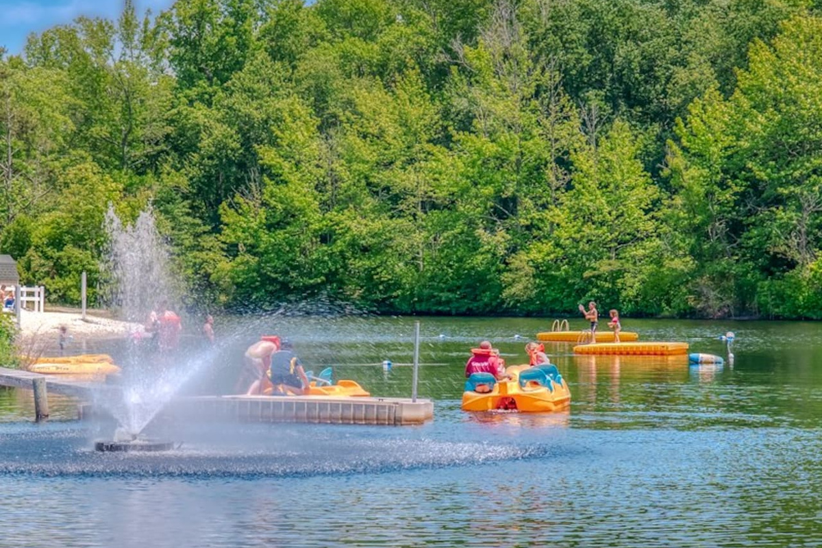 Swimming lake with kayak and paddle boat rentals