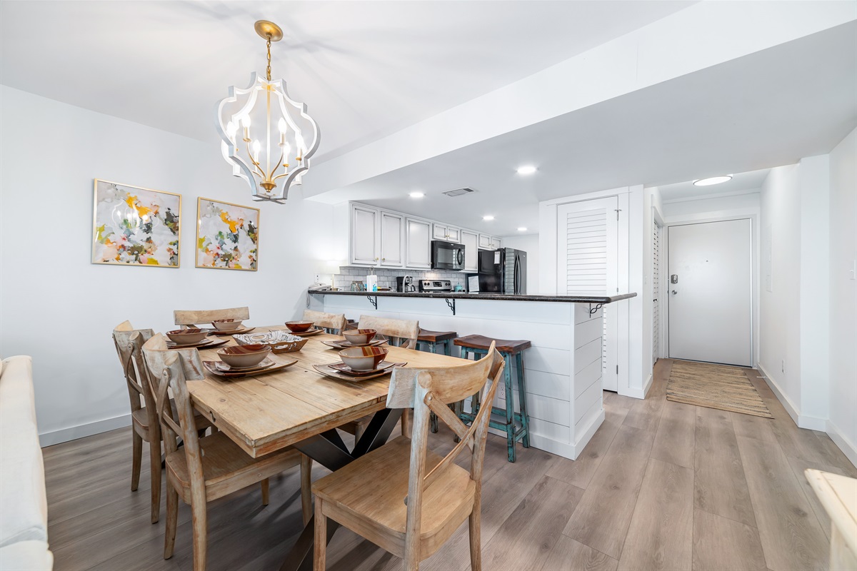 Gather, eat, and make memories. Our spacious dining area and adjacent breakfast bar provide plenty of room for guests to enjoy meals and conversations, creating the perfect setting for your vacation.