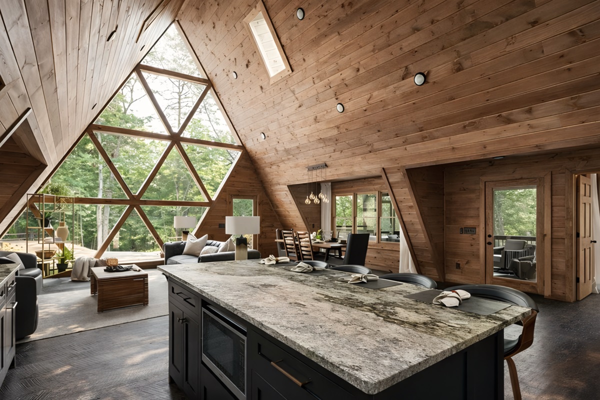 A kitchen where style meets function, marble island, clean lines, a space made for gathering.