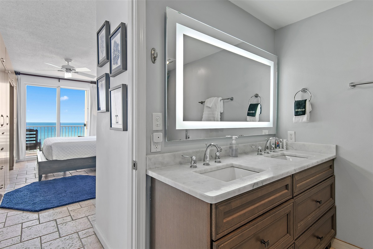 Spacious master bedroom features a King bed, Gulf views, balcony access, SMART TV w/ cable access, remodeled bathroom with walk in shower, and large closet.