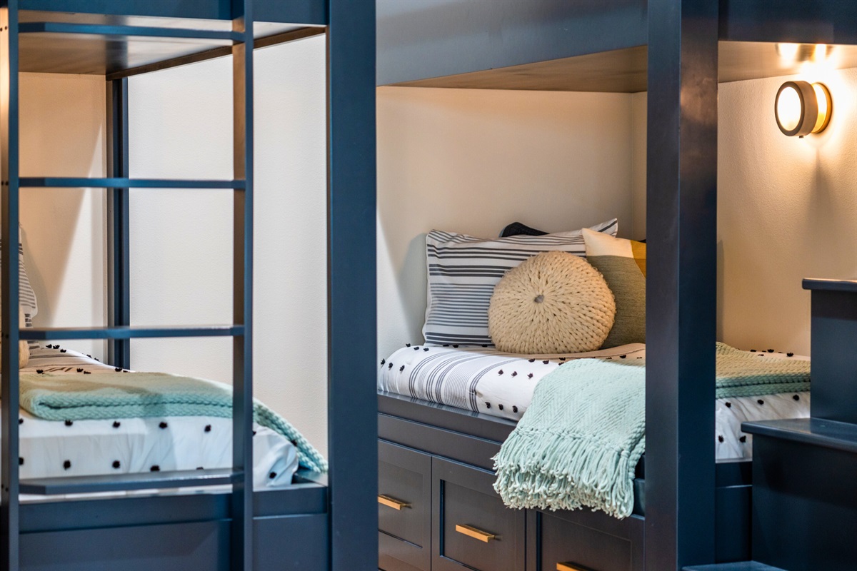 Each bunk has its own light, making it perfect for bedtime reading or late-night chats, ensuring everyone has their own cozy nook.