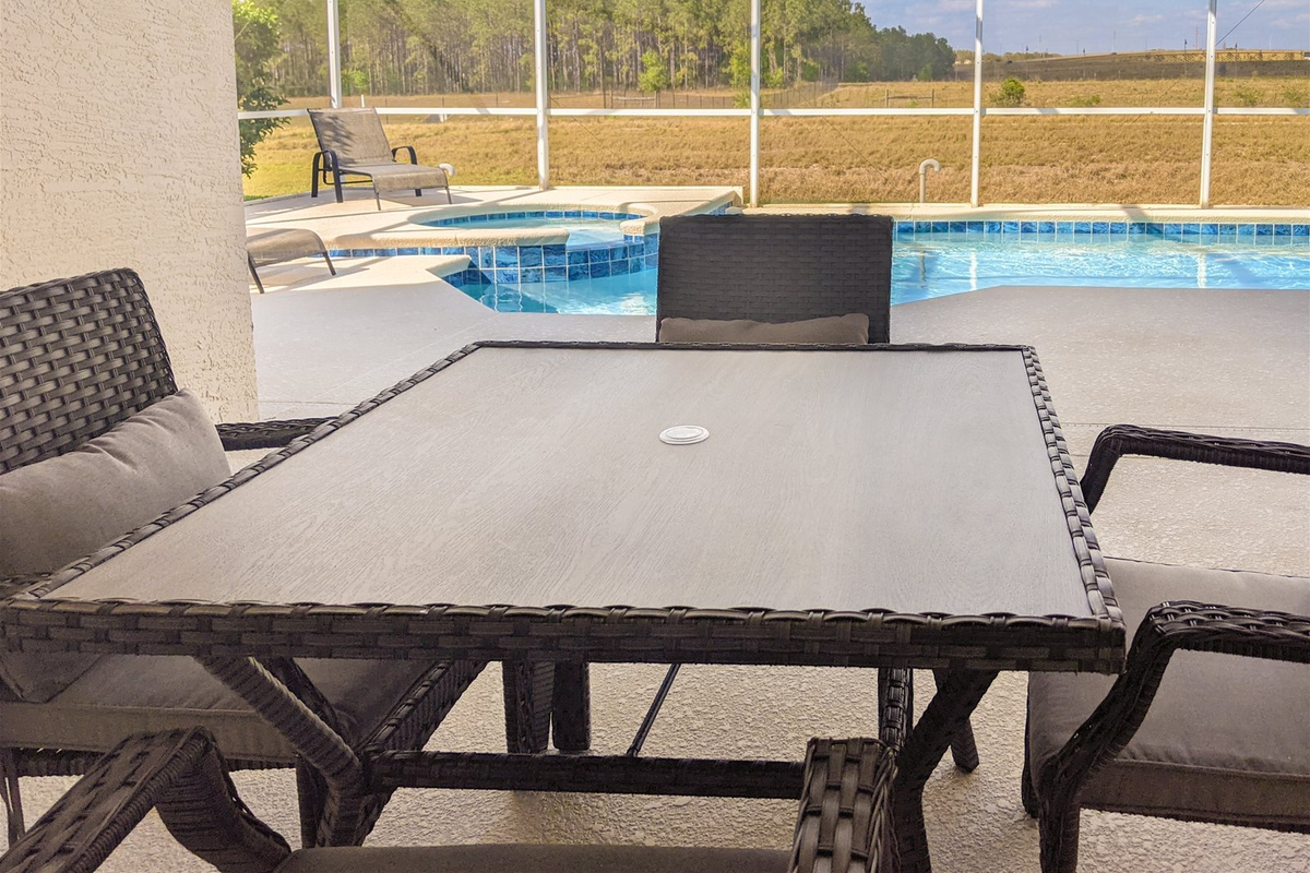 Poolside Dining area with a relaxing view.