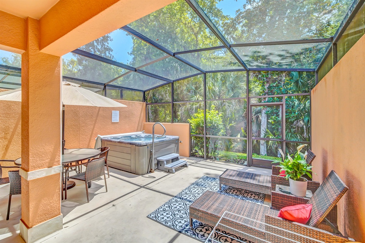Private lanai with hot tub, lounge area and dining area
