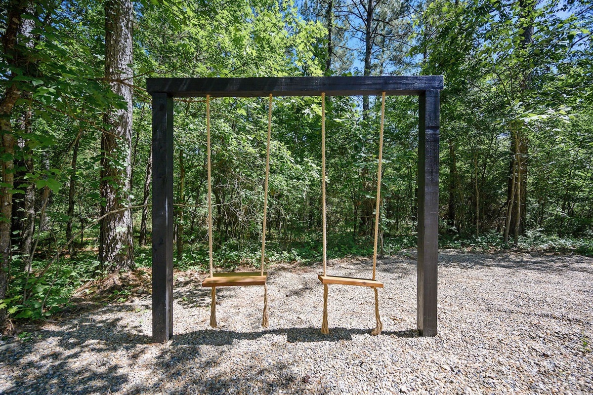 A perfect combination of comfort and outdoor charm—swing, relax, and watch the flames dance.