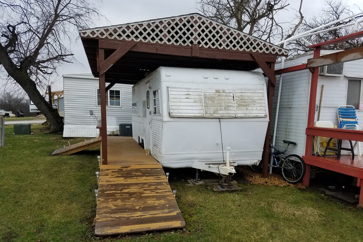Front of camper and deck area where you can relax with friends, dine, and enjoy the planes and skydivers landing, then later the night stars.