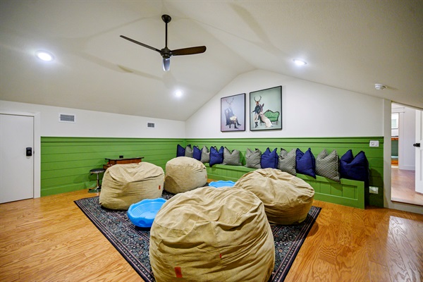 Kick back, relax, and let the good times roll in this comfy cabin game room.