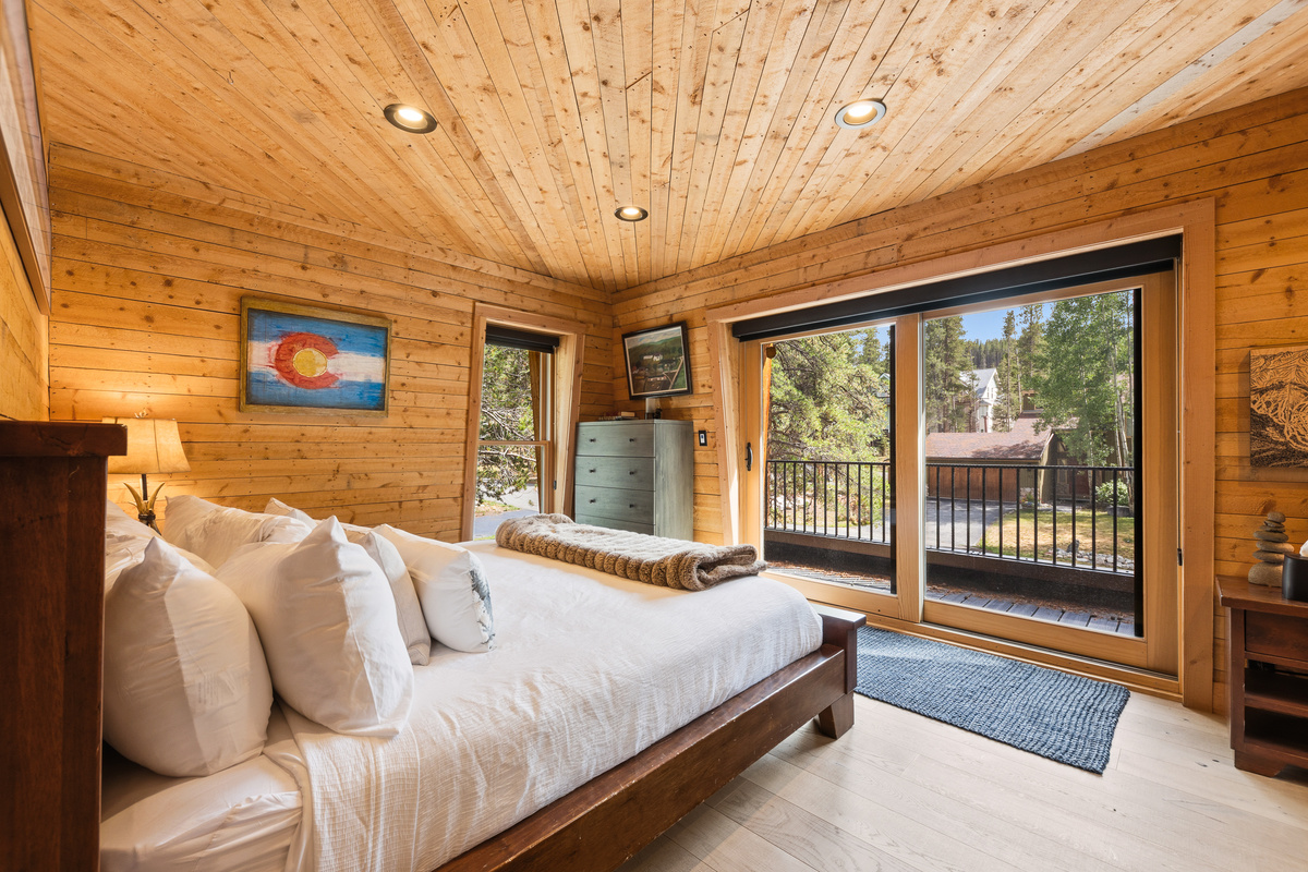 Upper level Junior Suite with king bed, en-suite full bathroom and private balcony