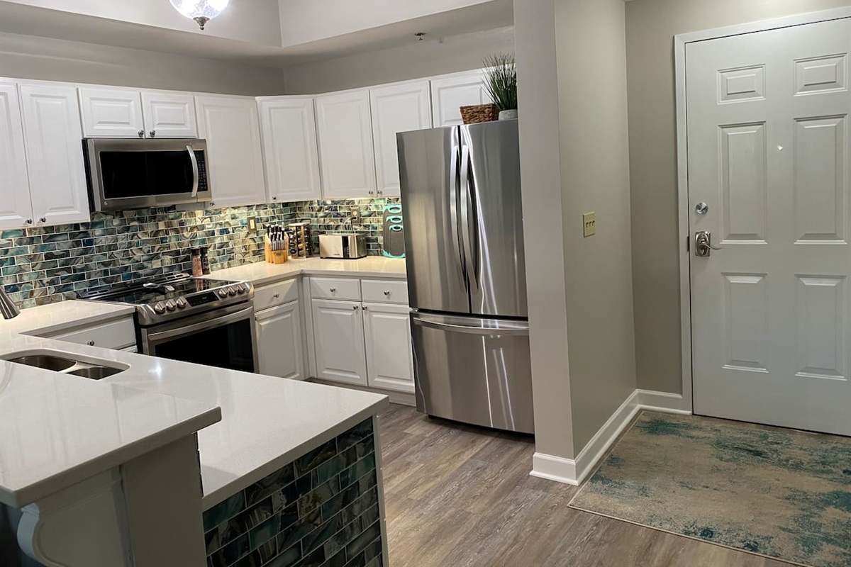 Enter through the breezeway door and stock your groceries for the week inside the LG refrigerator, prepare meals on or in the LG stove/oven or reheat your take-away in the Whirlpool microwave. The chef’s kitchen welcomes you!