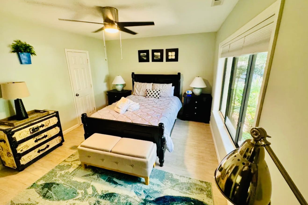 Primary bedroom with four-poster bed