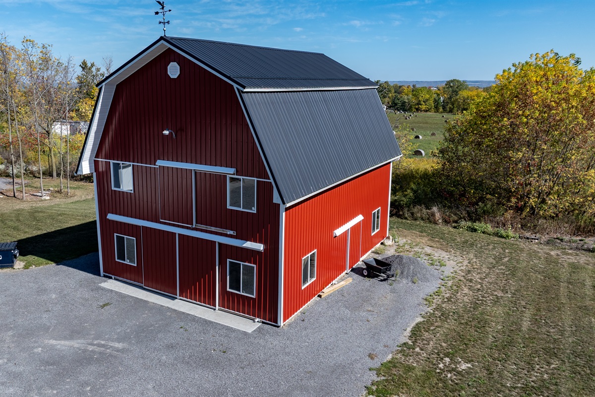 Classic red barn with scenic country views — the perfect blend of charm and simplicity