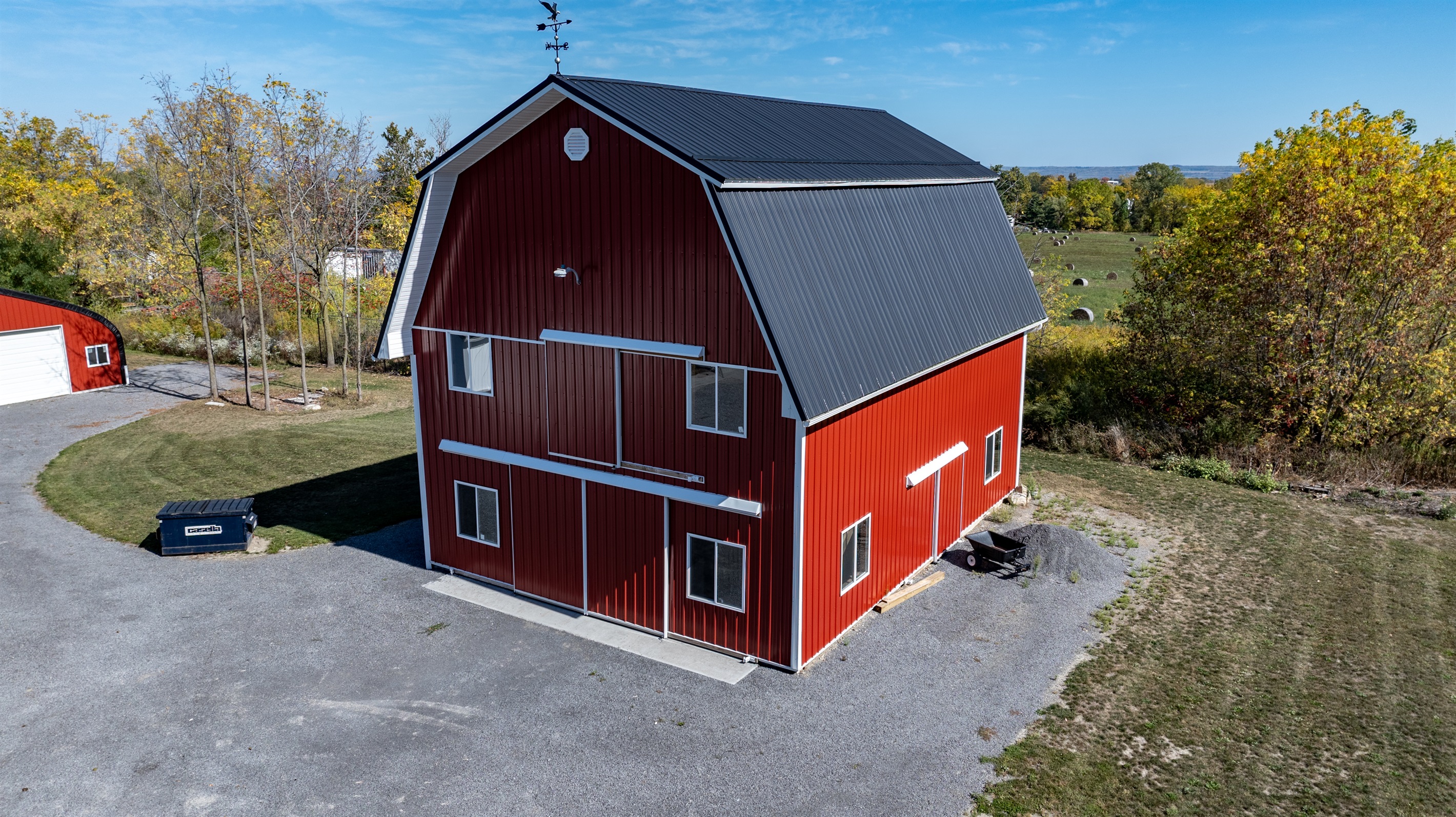 Classic red barn with scenic country views — the perfect blend of charm and simplicity