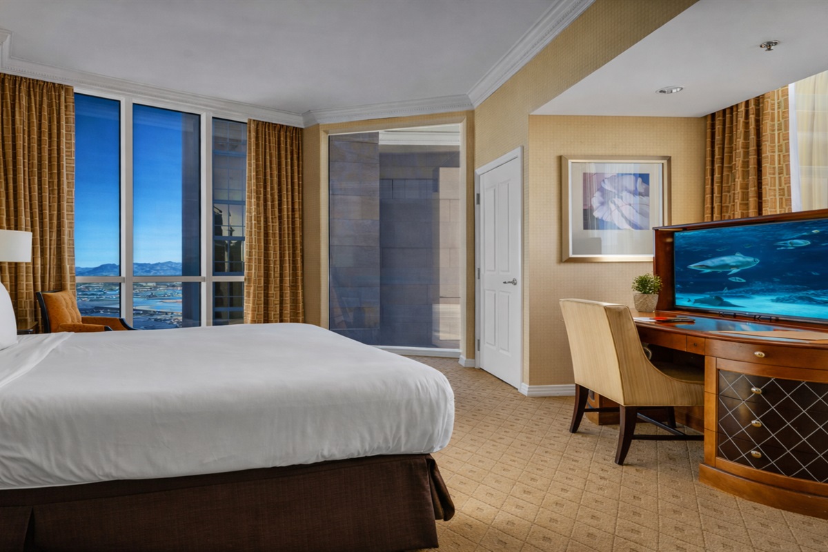 Wake up to stunning cityscapes in this plush bed! 