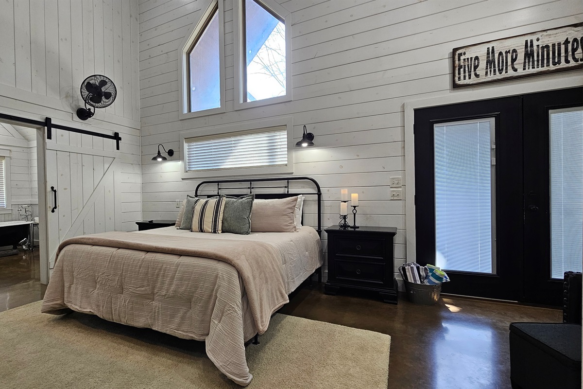 Charming Retreat: Relax in this stylish room with stunning stone accents and nature views!