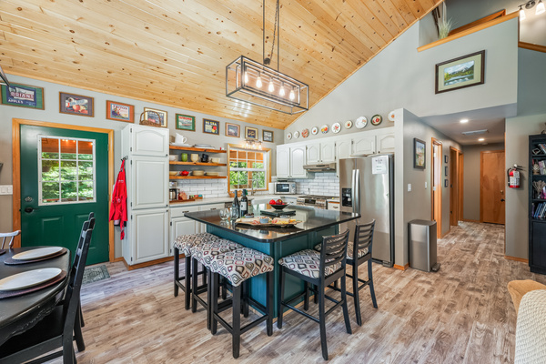 Kitchen has large island with seating for 5