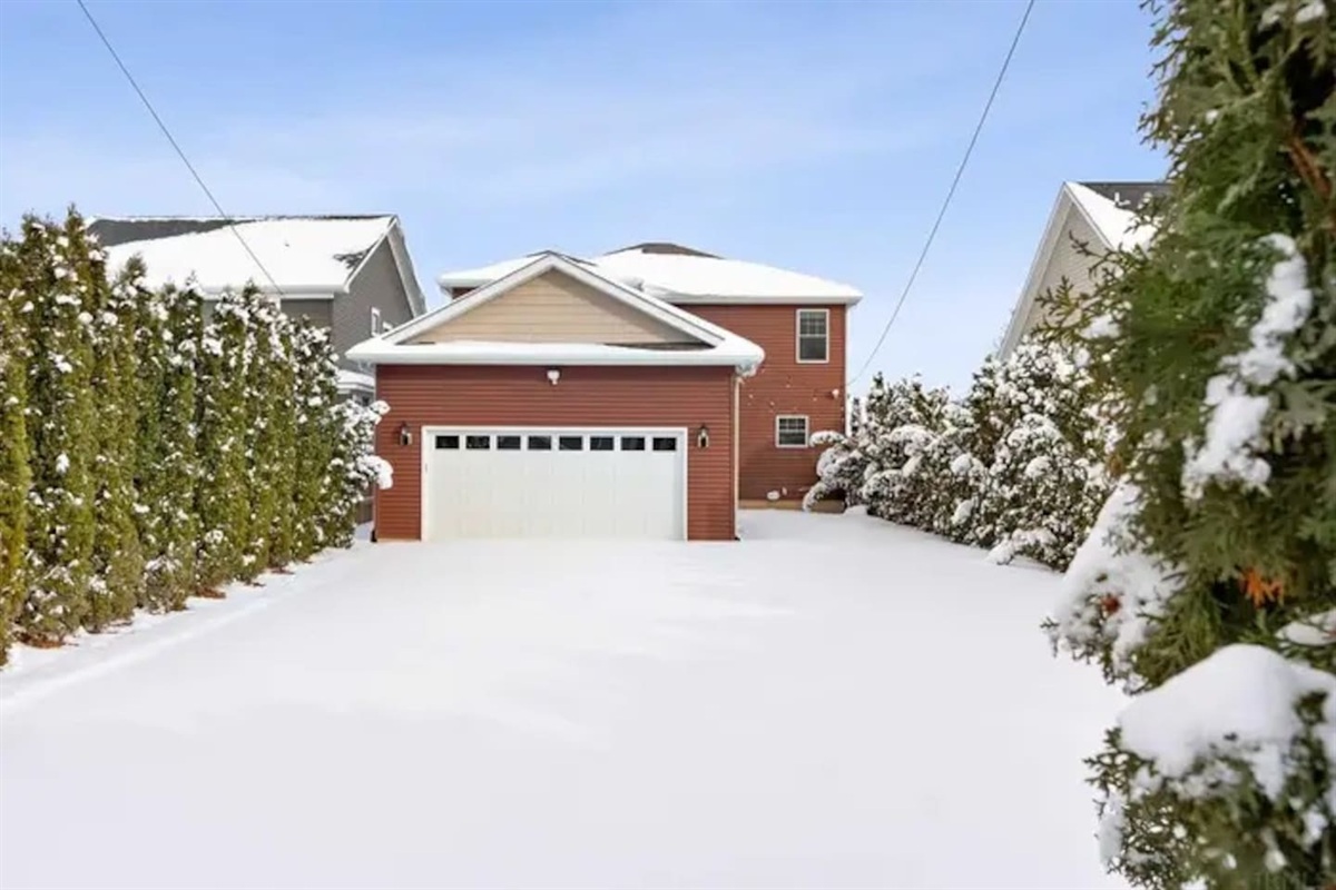 Large private backyard lined with beautiful privacy trees and fully fenced in. Large Lawn area as well as a large parking area. There is enough room for 5 cars leaving plenty of room to enjoy the backyard.