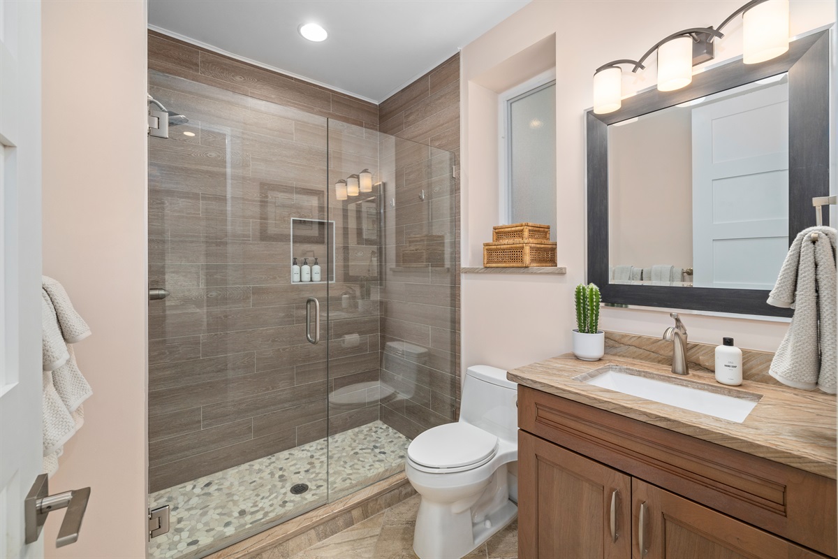 Stylish bathroom with walk-in shower and contemporary finishes