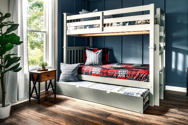 Wake up to a warm sunshine and breathe in the fresh, crisp mountain air. This cozy main-floor secondary bedroom features a twin size bunk bed with a trundle - Sleeps 3.