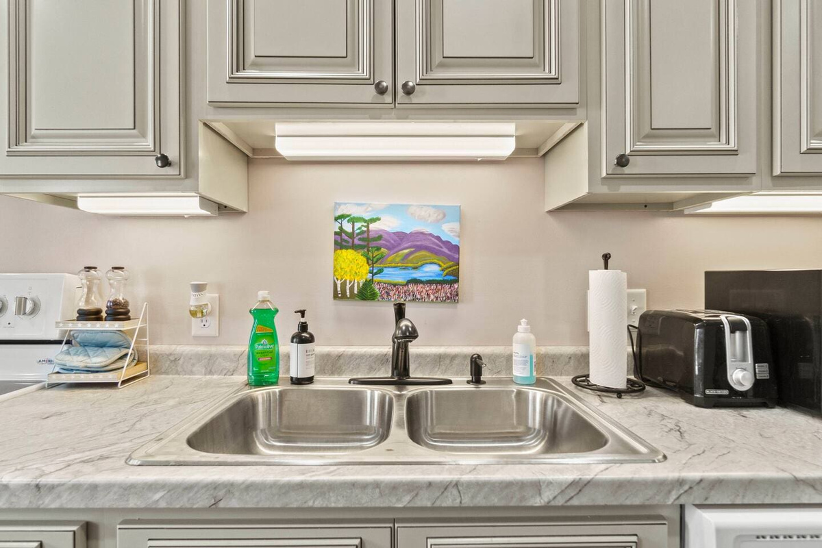 Spacious and spotless kitchen sink, designed for convenience and easy meal prep.