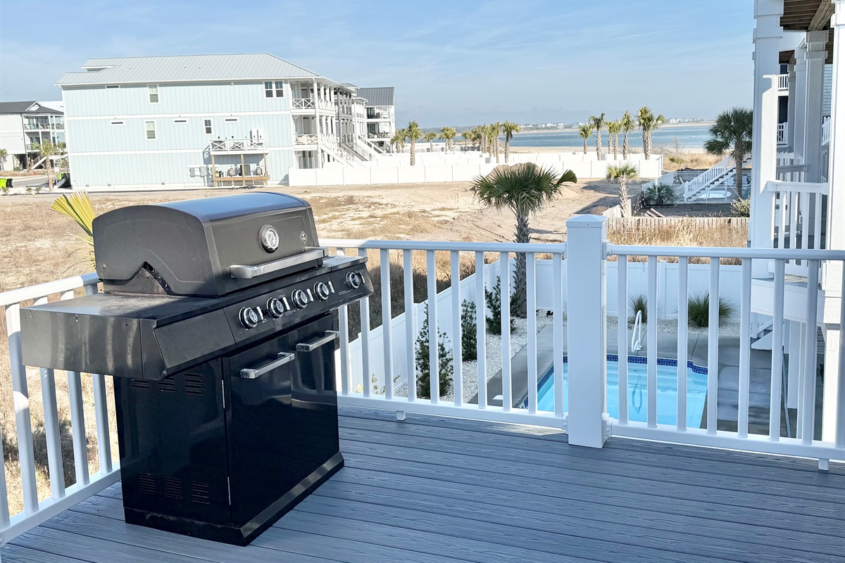 Gas grill on back deck.