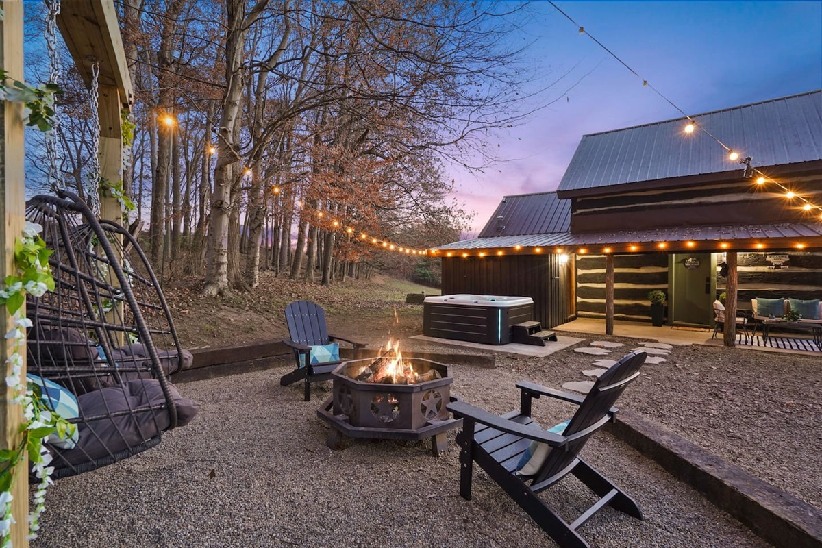 Dreamy fire pit haven - 2 Adirondack chairs, 2 swings, and a pergola create a magical space for sharing stories and making s'mores
