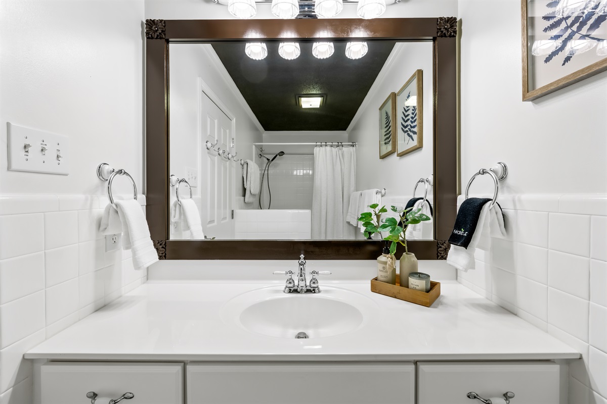 Conveniently located bathroom with thoughtful touches throughout.